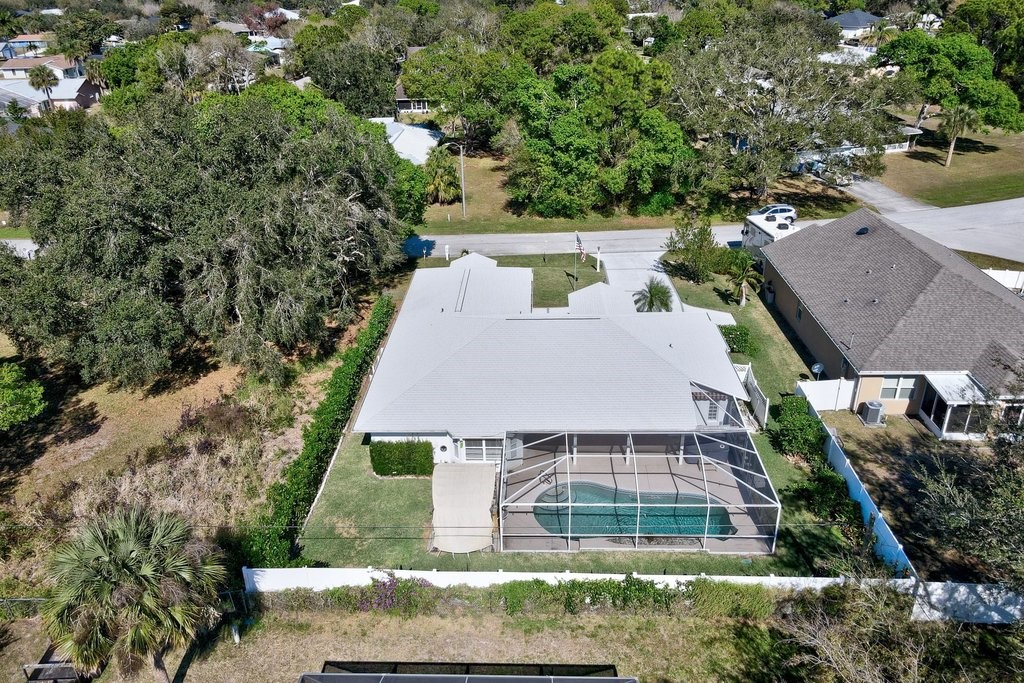 738 Benedictine Terrace Sebastian, FL 32958 - Photo 32 of 33 an aerial view of a house with a yard
