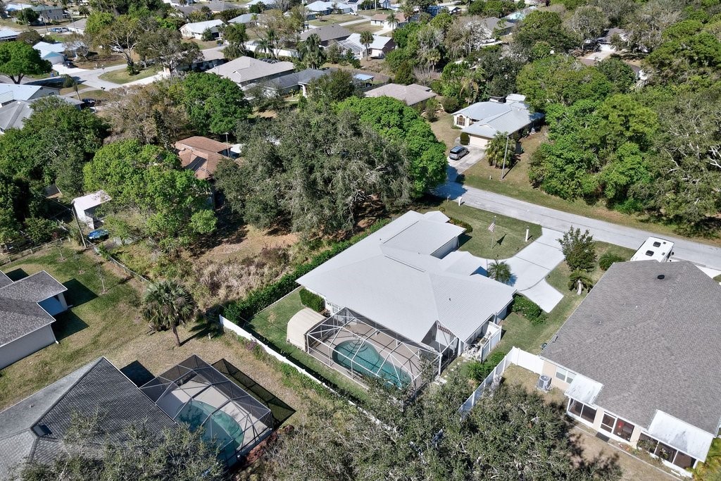 738 Benedictine Terrace Sebastian, FL 32958 - Photo 33 of 33 an aerial view of a house with a yard