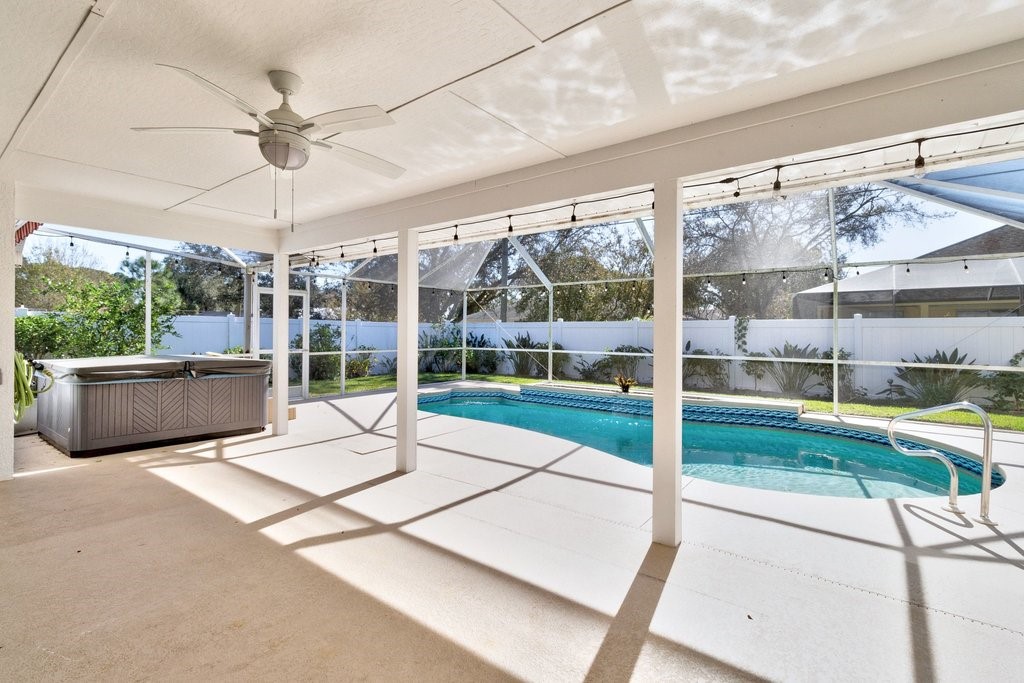 738 Benedictine Terrace Sebastian, FL 32958 - Photo 4 of 33 a living room filled with furniture and a floor to ceiling window