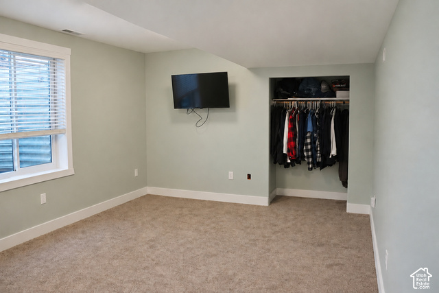 580 North 300 East Logan, UT 84321 - Photo 46 of 96 Window with white blinds, neutral carpet flooring, and a built-in closet with hanging rod and shelf