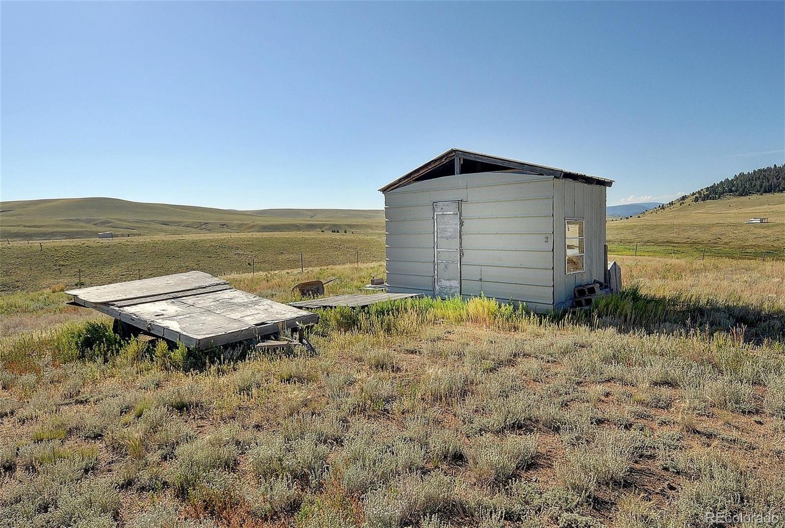 1245 Badger Creek Road Hartsel, CO 80449 - Photo 22 of 30 a house view with a lake view