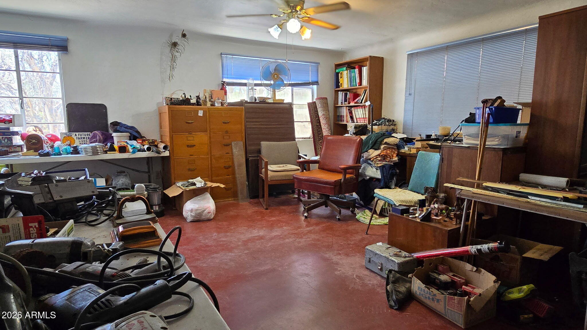 6803 South Miller Road Buckeye, AZ 85326 - Photo 11 of 50 a room with gym equipment and a large window