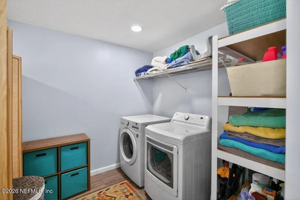 a bathroom with a double vanity sink toilet and shower