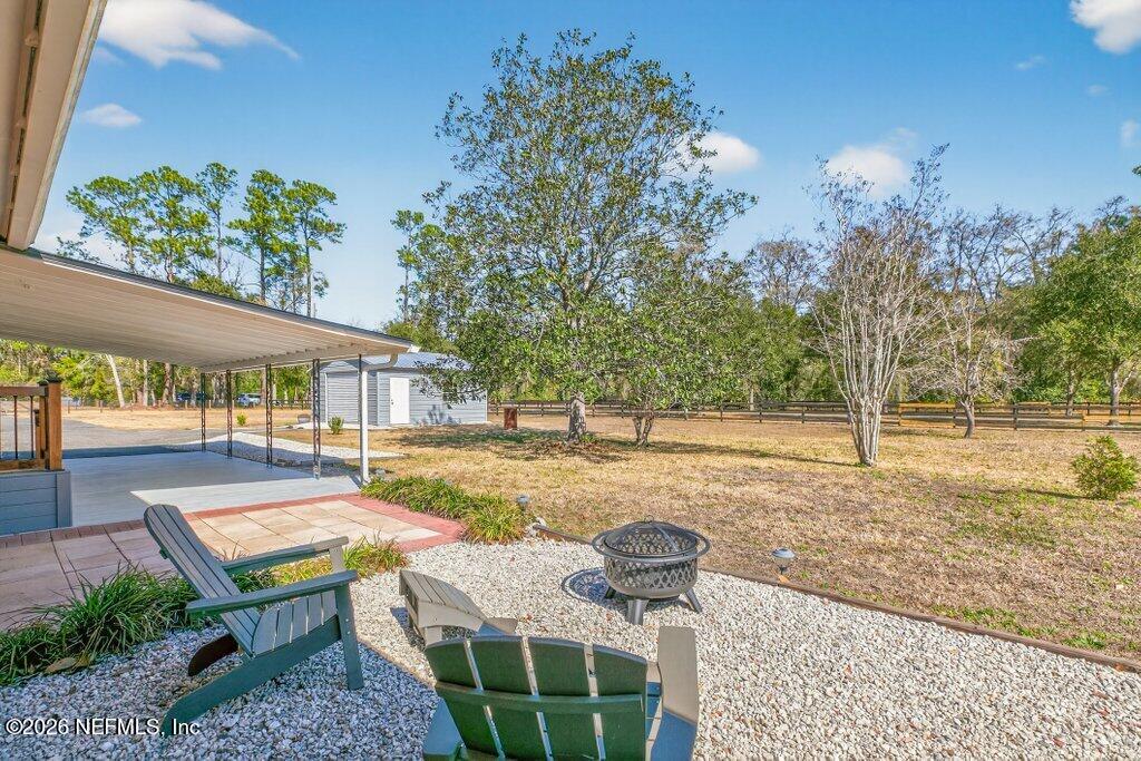 11049 Old Kings Road Jacksonville, FL 32219 - Photo 36 of 74 graveled firepit area