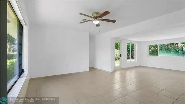 a view of a big room with a window