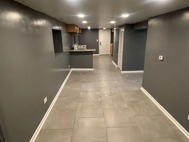 a view of kitchen with cabinets