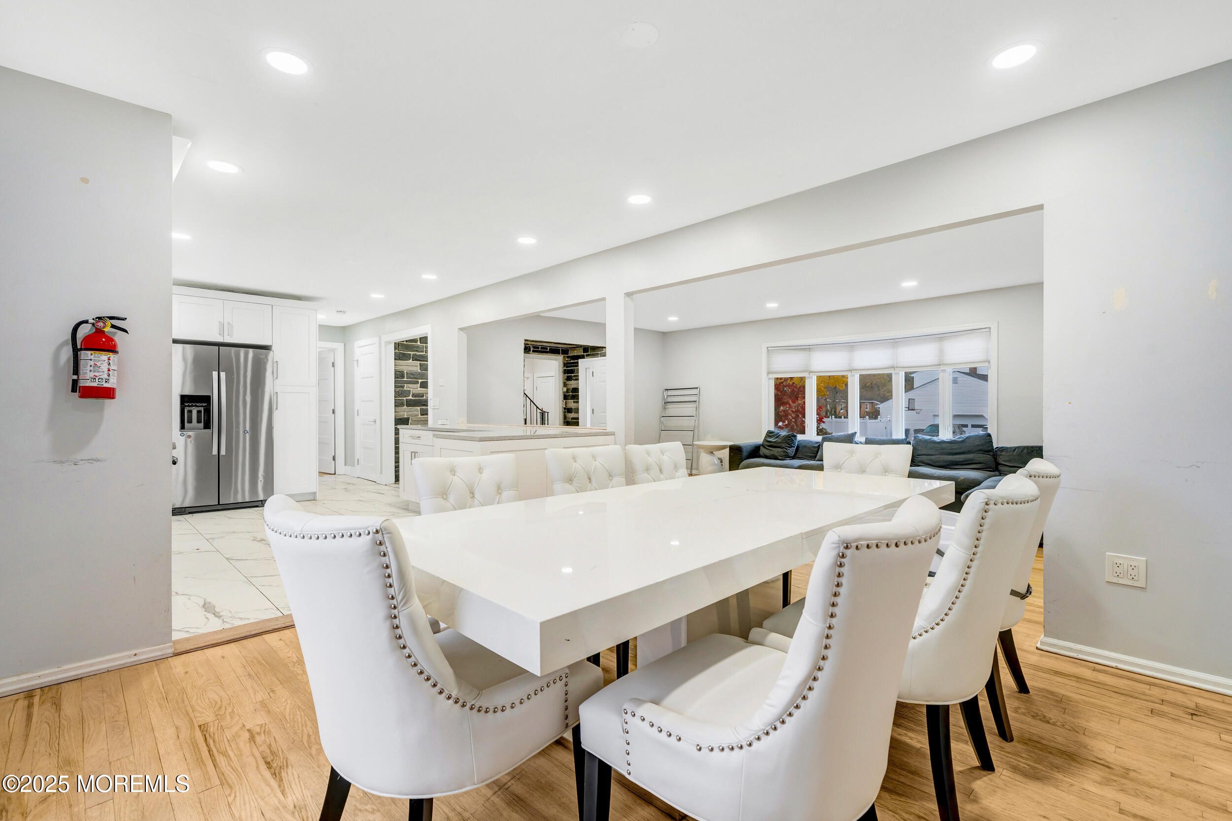 104 Pear Street Oakhurst, NJ 07755 - Photo 11 of 44 a view of a dining room with furniture and wooden floor