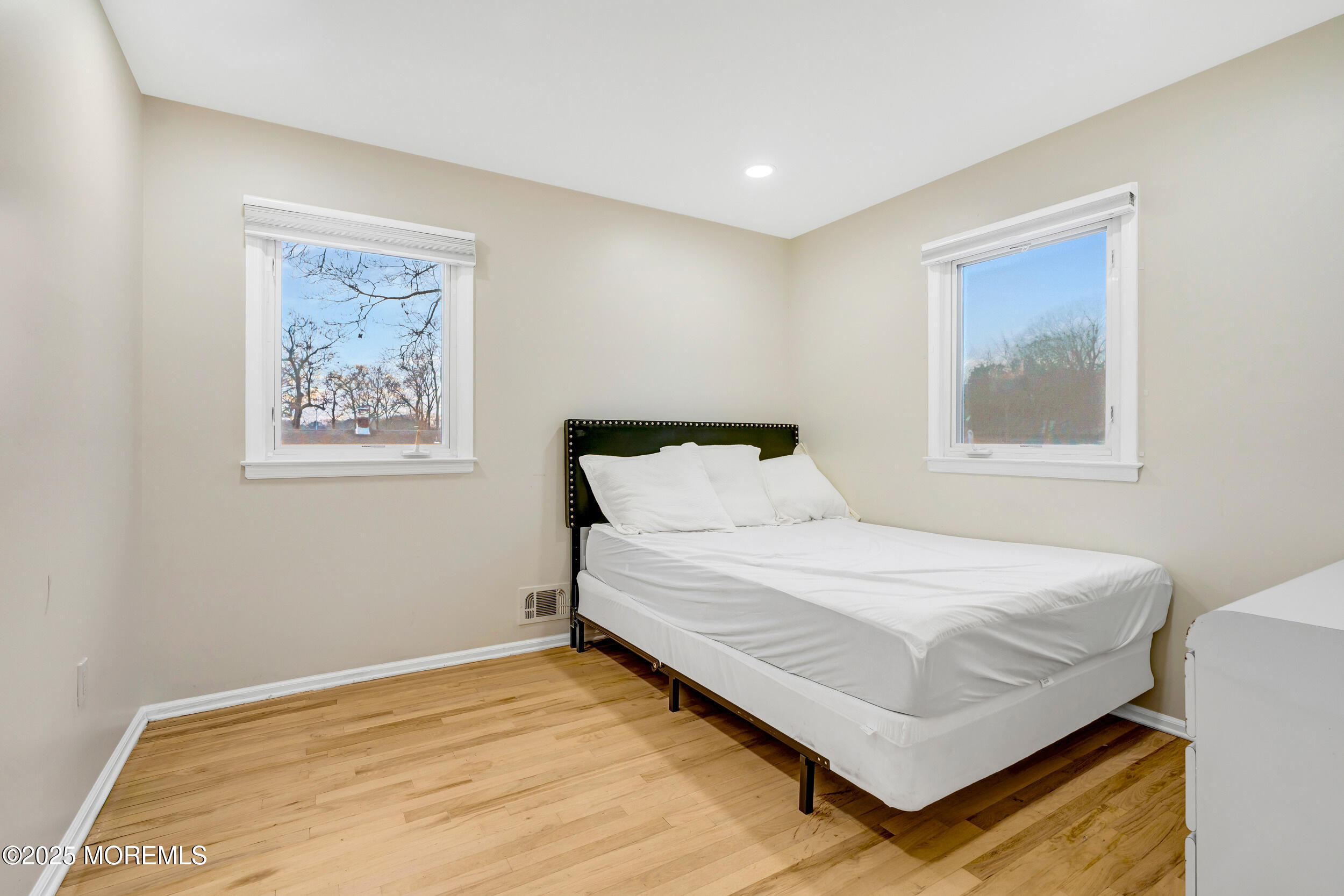 104 Pear Street Oakhurst, NJ 07755 - Photo 27 of 44 a bedroom with a bed and a window