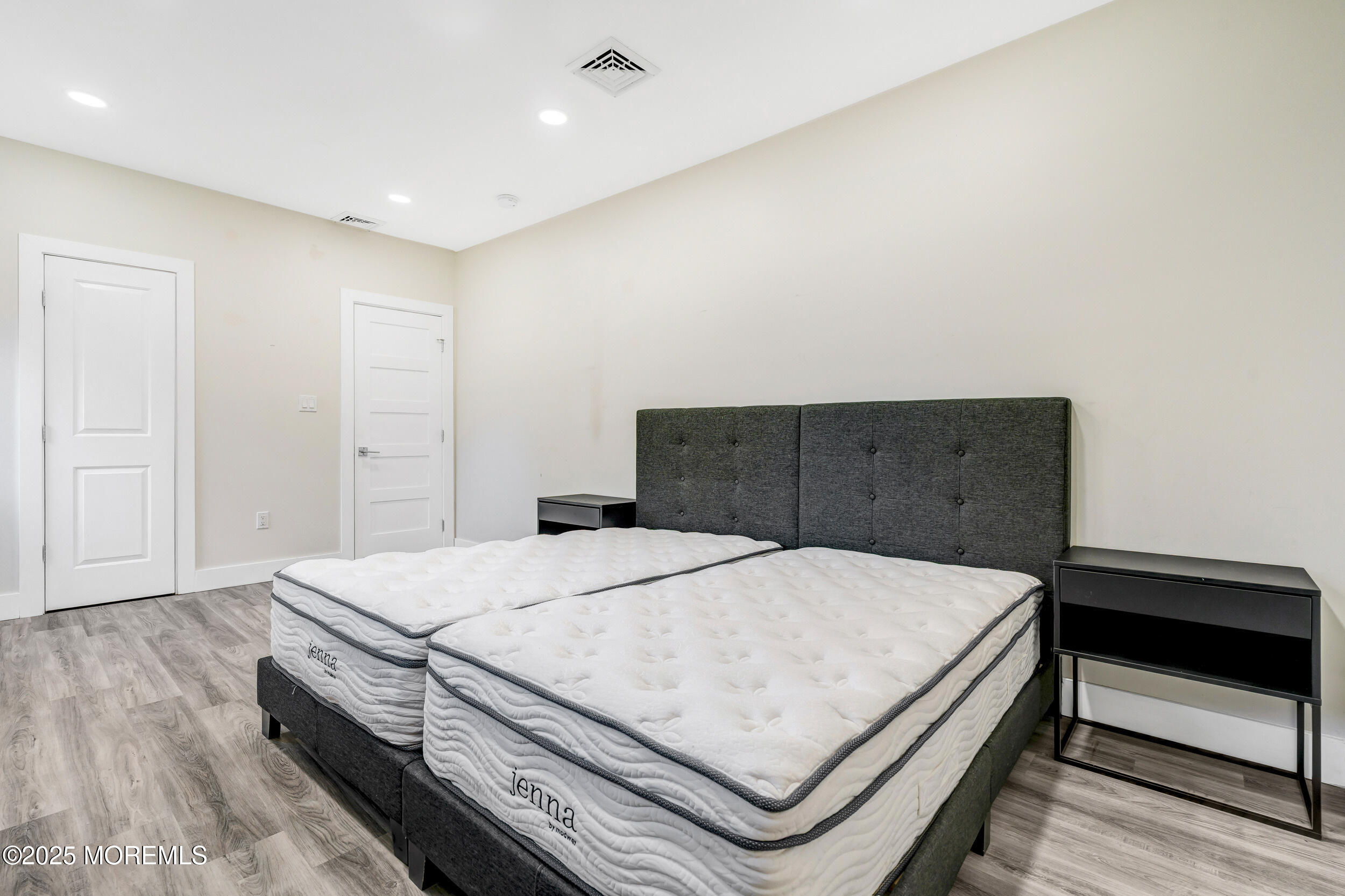 104 Pear Street Oakhurst, NJ 07755 - Photo 29 of 44 a bedroom with a bed and cabinet