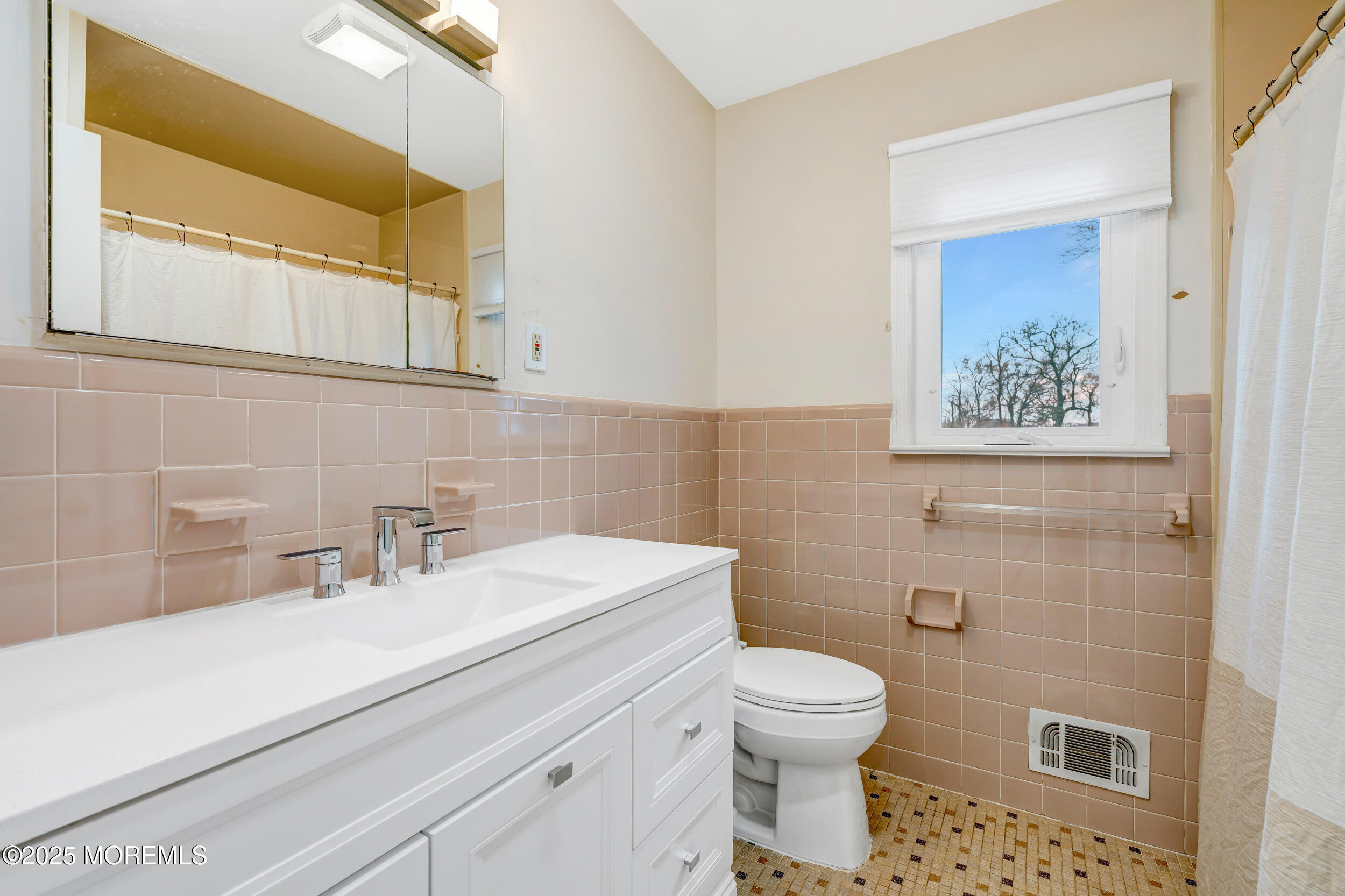 104 Pear Street Oakhurst, NJ 07755 - Photo 30 of 44 a bathroom with a toilet sink and mirror