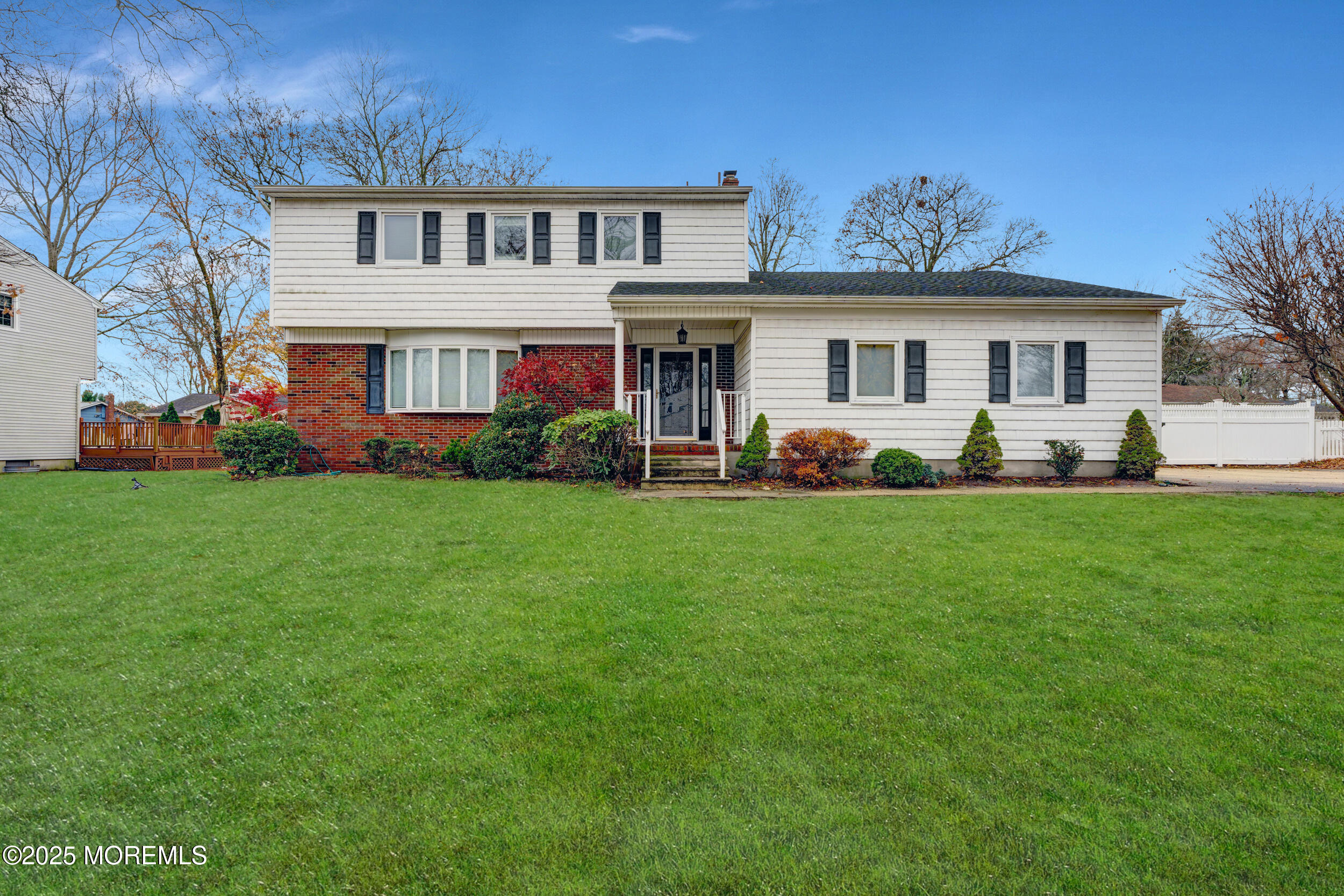 104 Pear Street Oakhurst, NJ 07755 - Photo 44 of 44 a front view of a house with a yard and tree