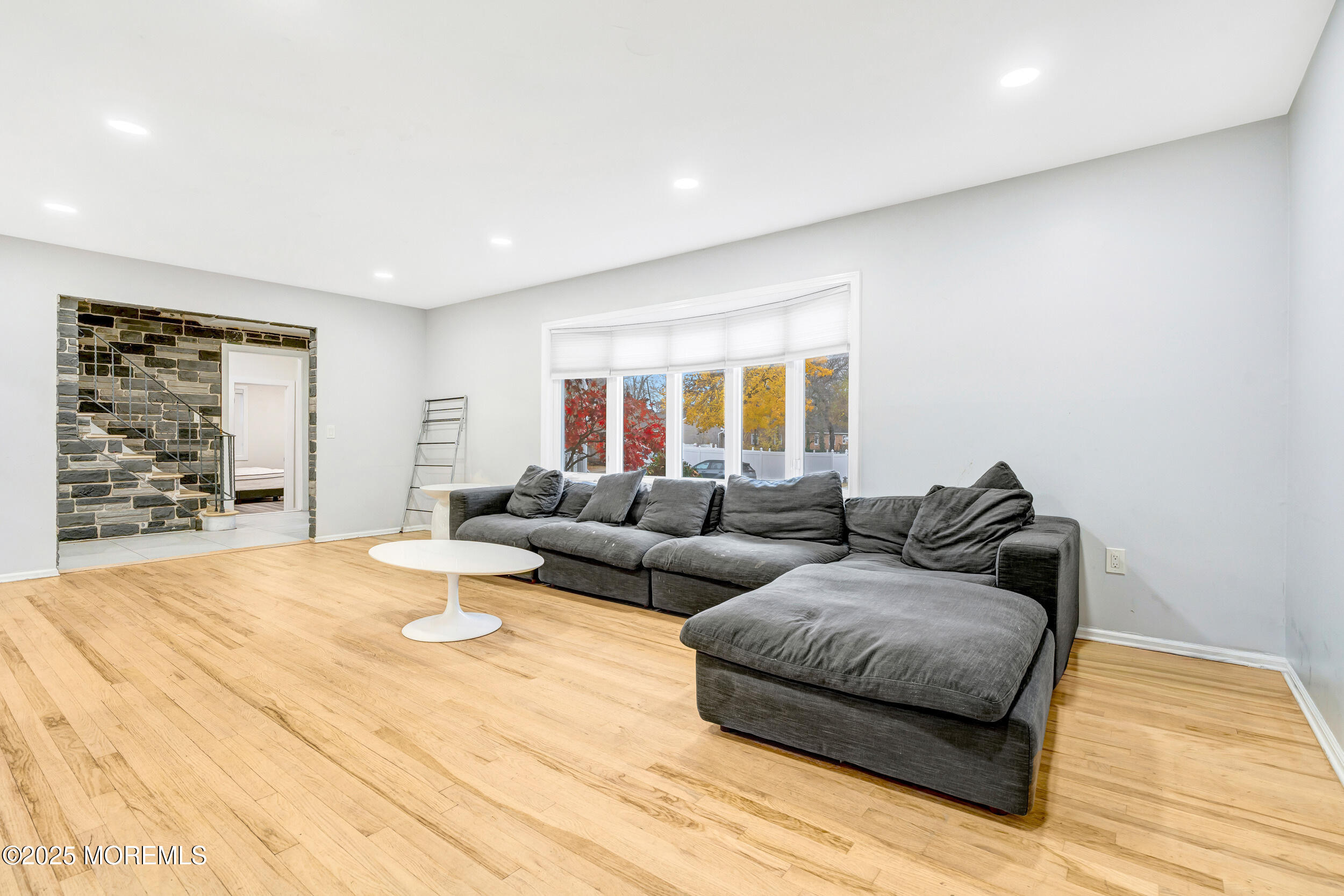 104 Pear Street Oakhurst, NJ 07755 - Photo 9 of 44 a living room with couches and painting on the wall