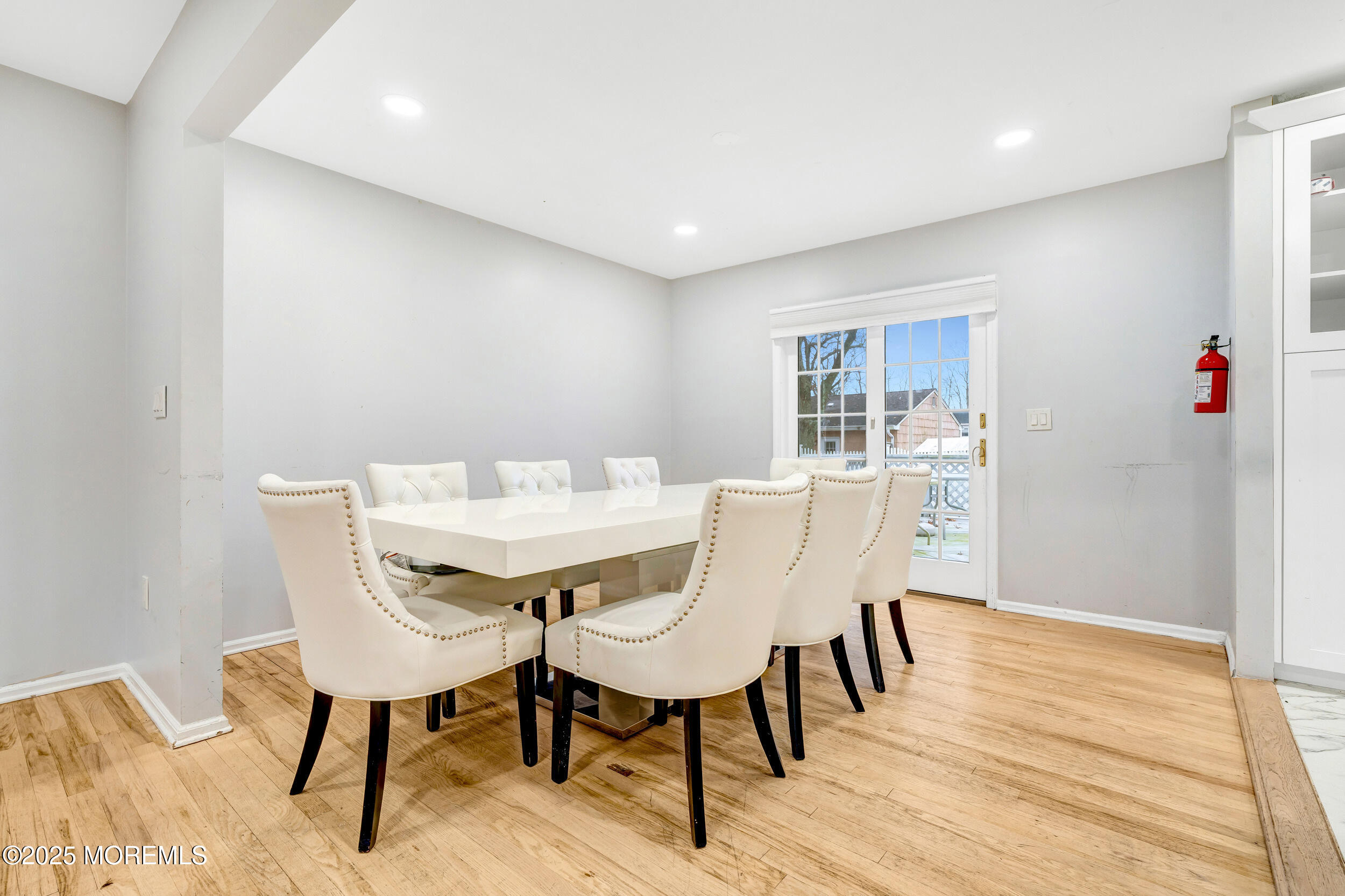 104 Pear Street Oakhurst, NJ 07755 - Photo 10 of 44 a view of a dining room with furniture and wooden floor