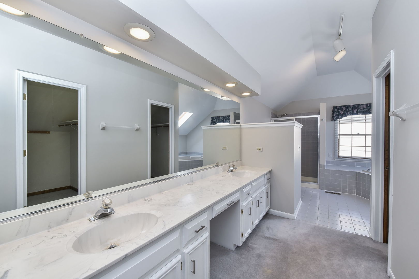 1759 Mundelein Road Naperville, IL 60565 - Photo 15 of 39 a spacious bathroom with a double vanity sink and mirror