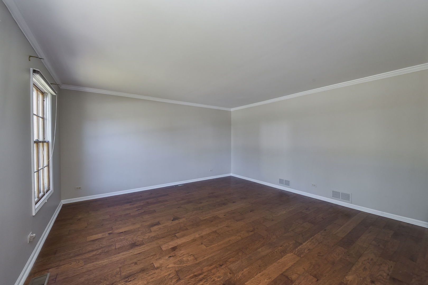 1759 Mundelein Road Naperville, IL 60565 - Photo 3 of 39 an empty room with wooden floor and windows