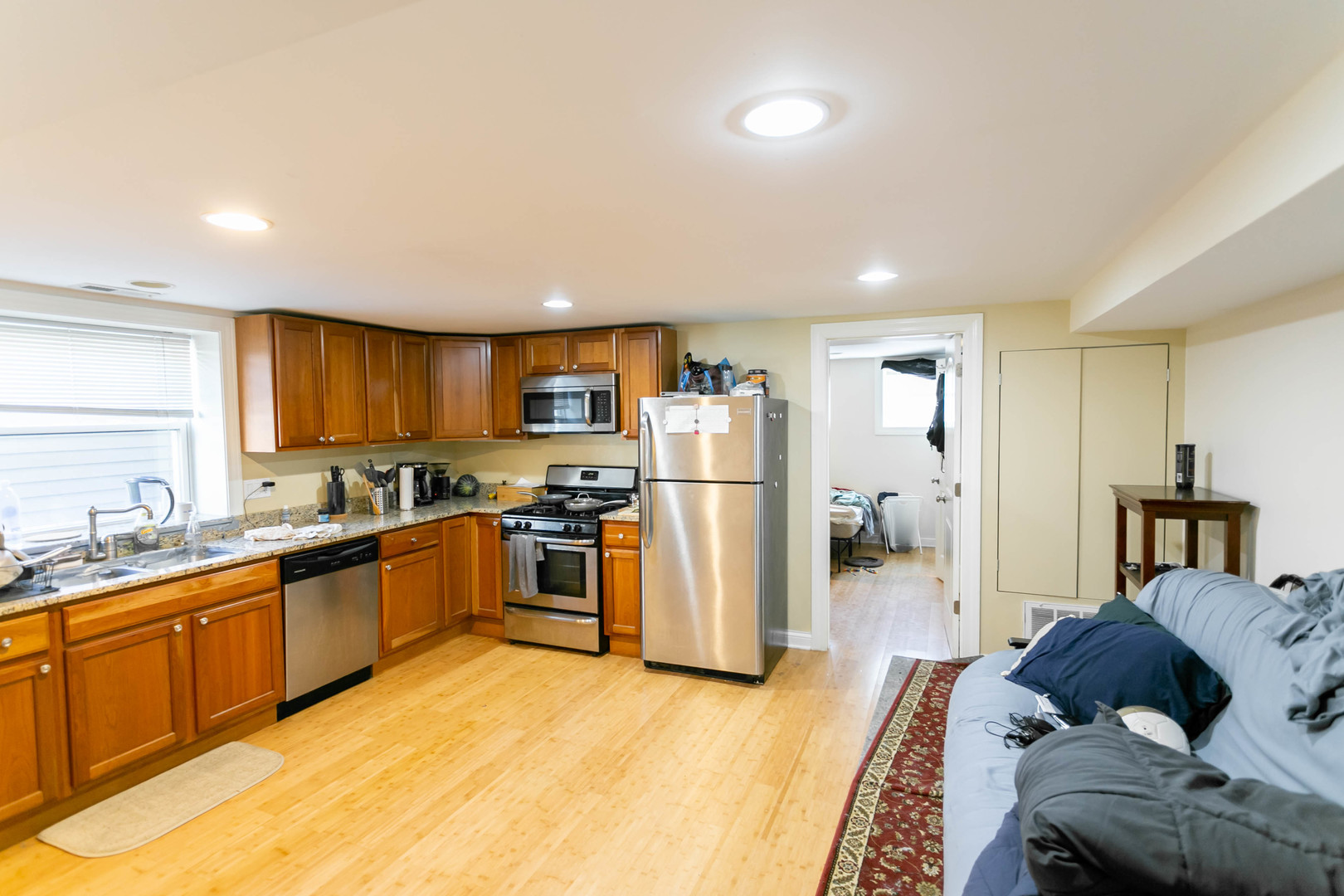 1623 West Huron Street, Unit 1R Chicago, IL 60622 - Photo 2 of 8 a kitchen with stainless steel appliances granite countertop a refrigerator and a sink