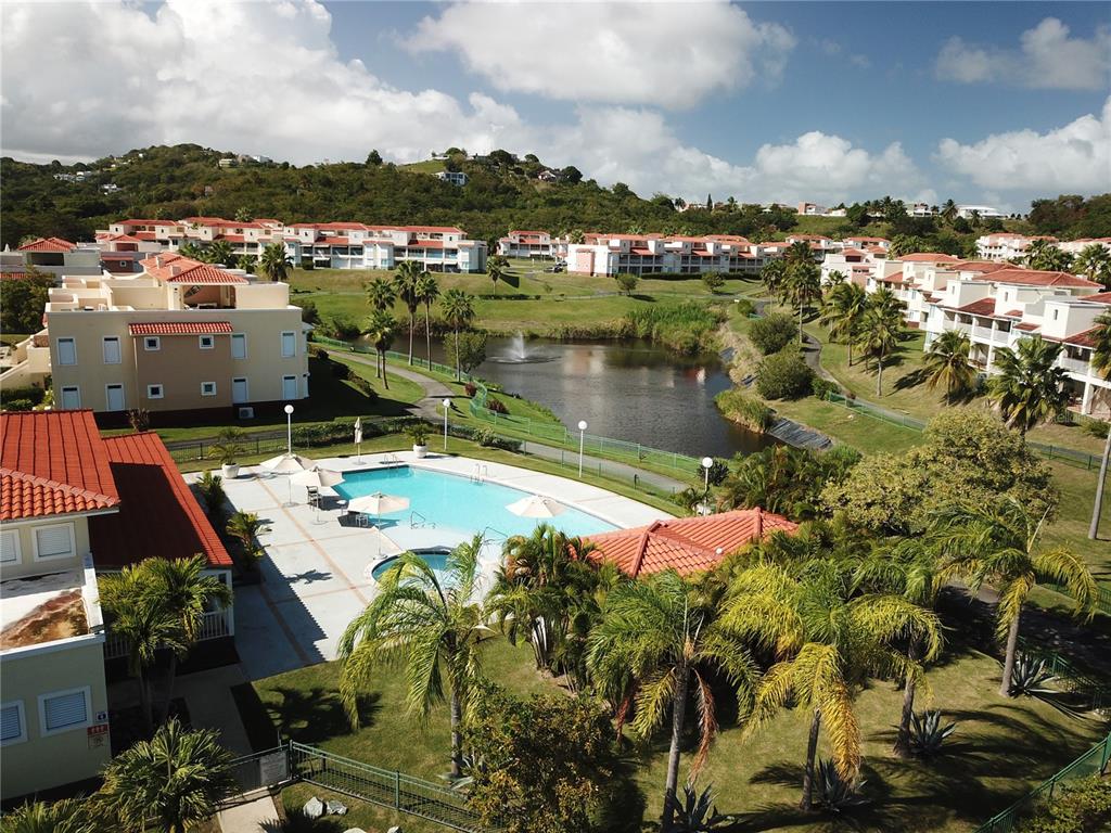 180 Palmas Drive, Unit 48C Humacao, PR 00791 - Photo 20 of 21 an aerial view of a house with a lake view