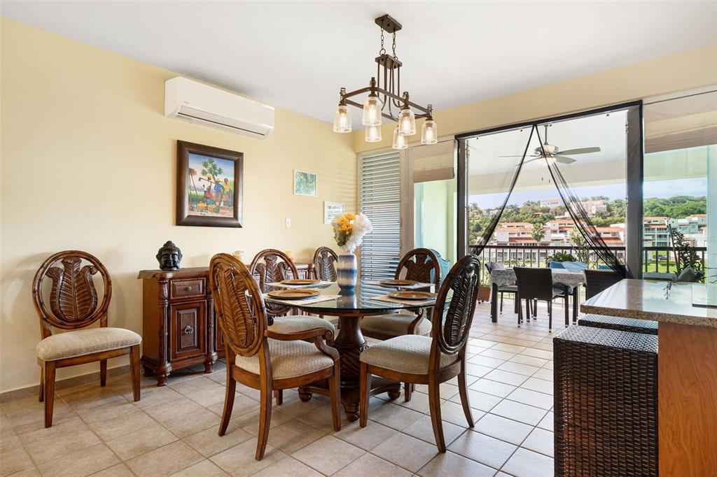 180 Palmas Drive, Unit 48C Humacao, PR 00791 - Photo 7 of 21 a view of a dining room with furniture window and outside view