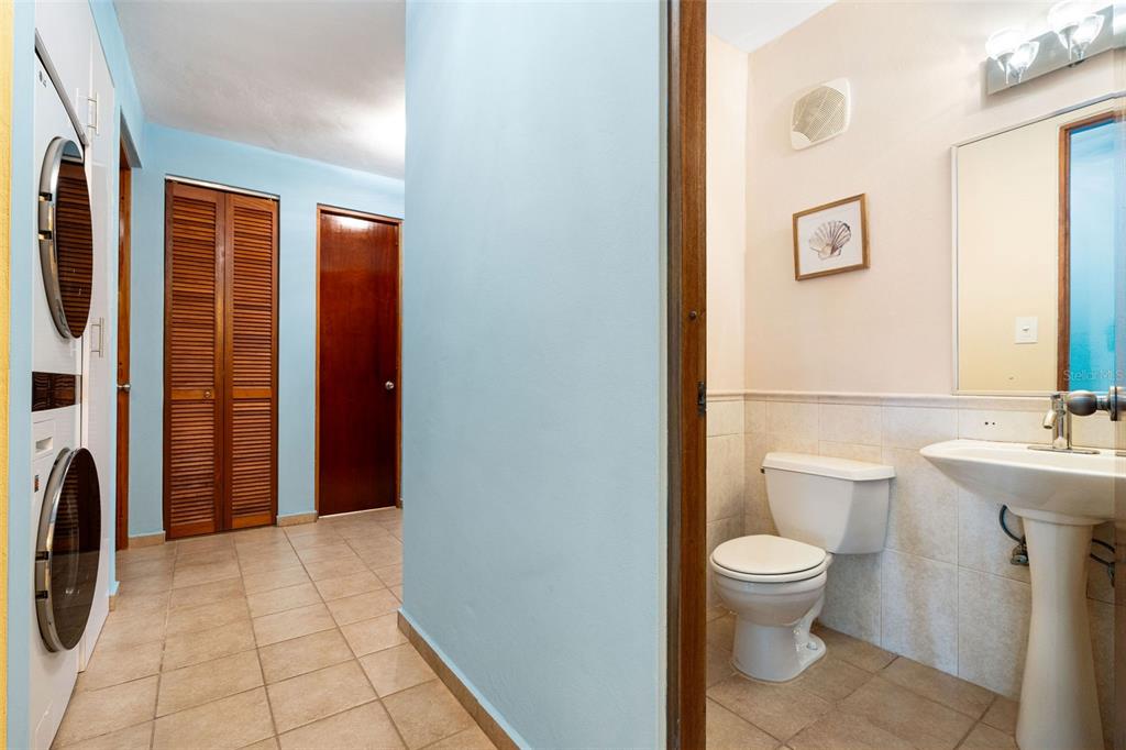 180 Palmas Drive, Unit 48C Humacao, PR 00791 - Photo 8 of 21 a bathroom with a toilet sink and shower
