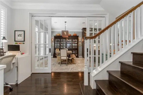 a view of entryway and hall with wooden floor