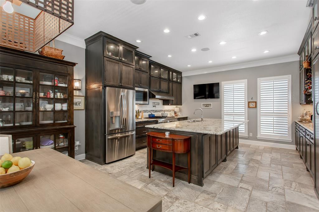 2226 City Market Lane Dallas, TX 75201 - Photo 17 of 40 a kitchen with stainless steel appliances granite countertop a stove and a refrigerator