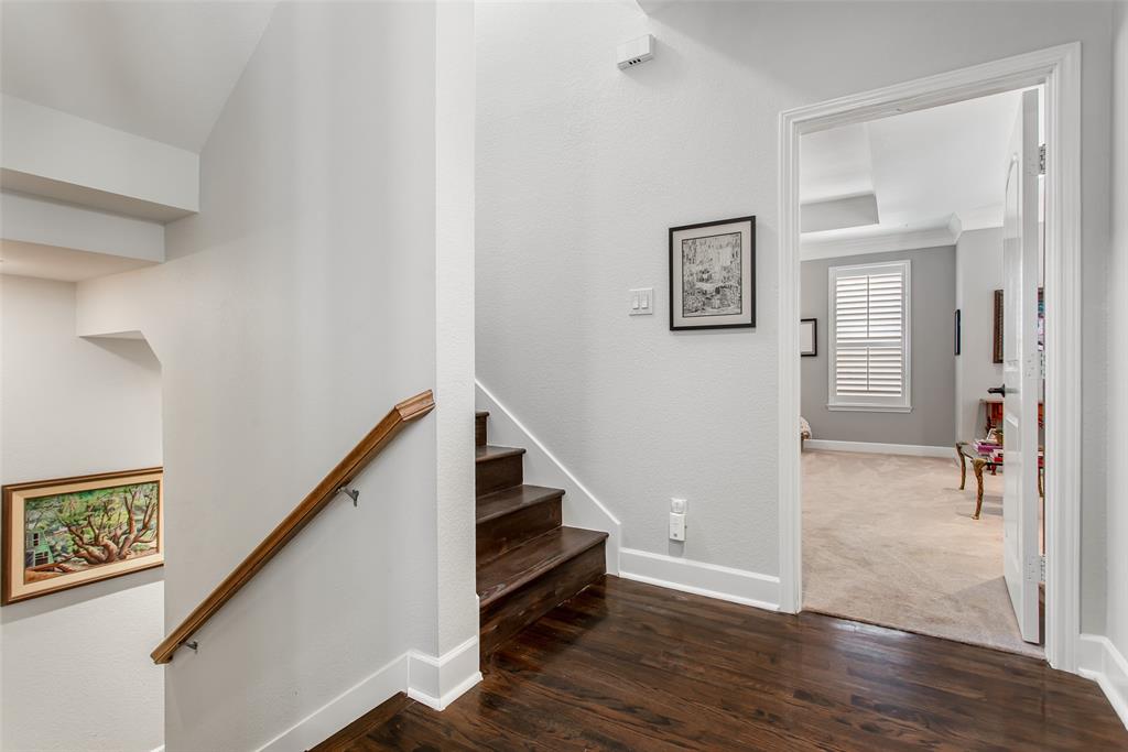 2226 City Market Lane Dallas, TX 75201 - Photo 21 of 40 a view of a hallway with wooden floor and stairs