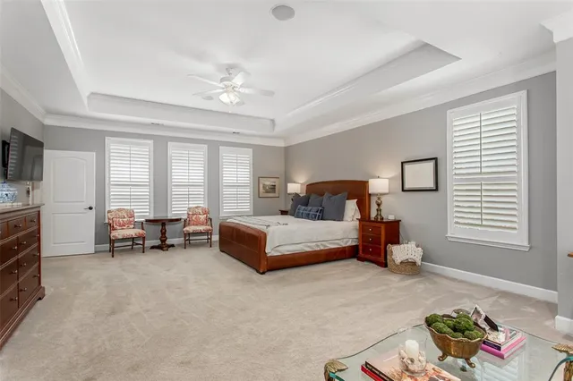 a bedroom with furniture and a flat screen tv