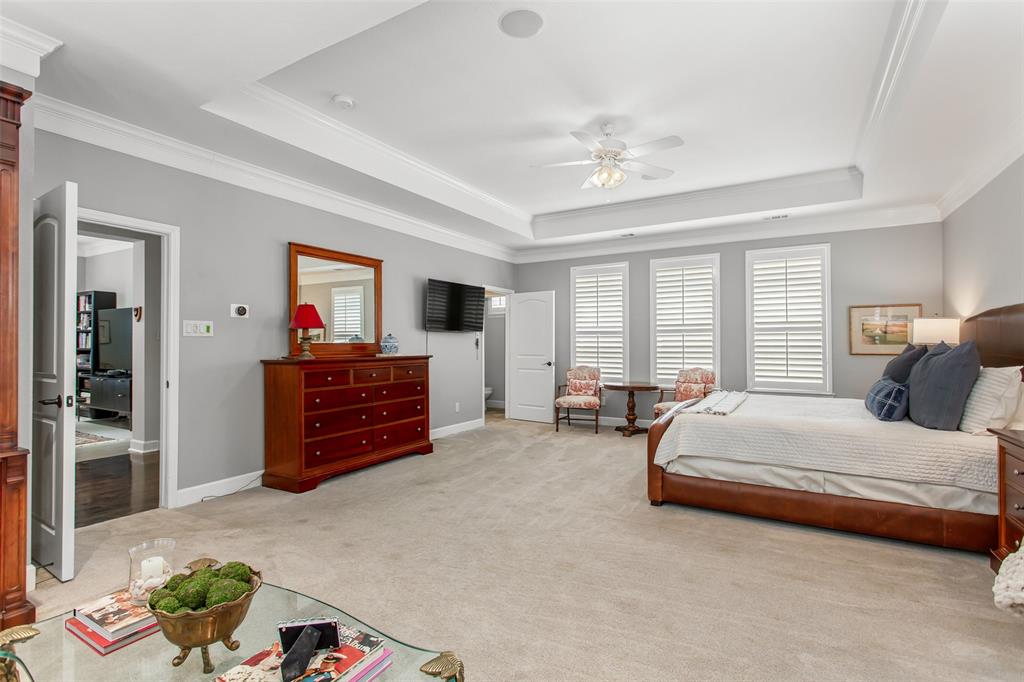 2226 City Market Lane Dallas, TX 75201 - Photo 24 of 40 a spacious bedroom with a bed and a chandelier