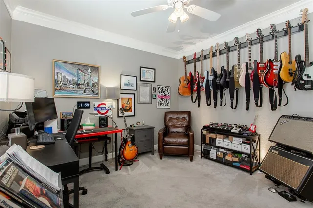 a bedroom with bed and a chandelier
