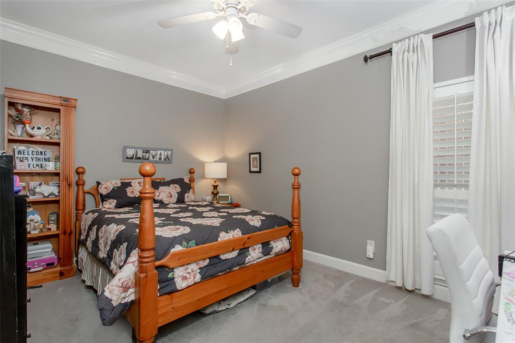 2226 City Market Lane Dallas, TX 75201 - Photo 31 of 40 a bedroom with bed and a chandelier