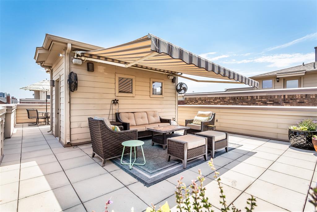 2226 City Market Lane Dallas, TX 75201 - Photo 36 of 40 a view of a patio with couches table and chairs with wooden floor