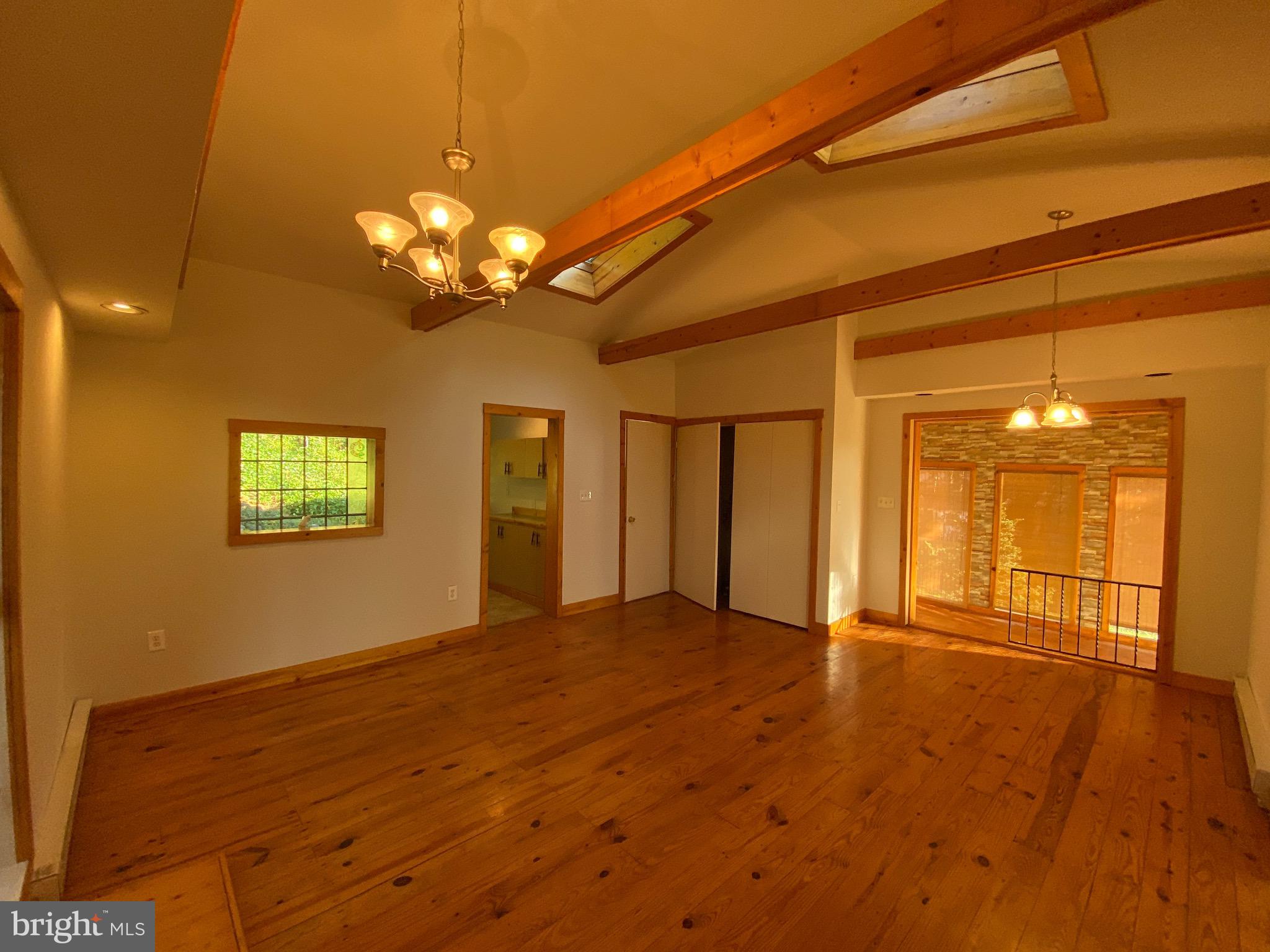 489 Peach Bottom Road Peach Bottom, PA 17563 - Photo 14 of 32 Living Room Leading to Bonus Room/Sun Room