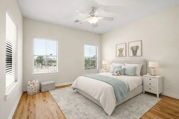 a bedroom with a large bed and a window
