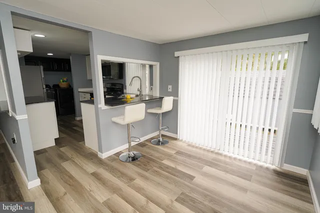 a room with a chair and a flat screen tv