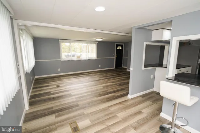 a bathroom with a sink a mirror and a shower