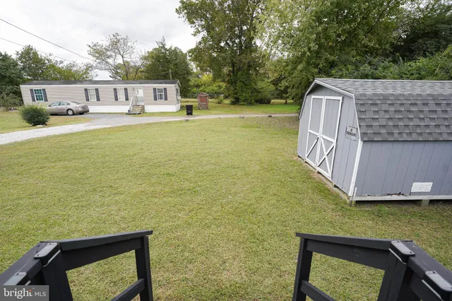 a view of a balcony with chair and floor to ceiling window