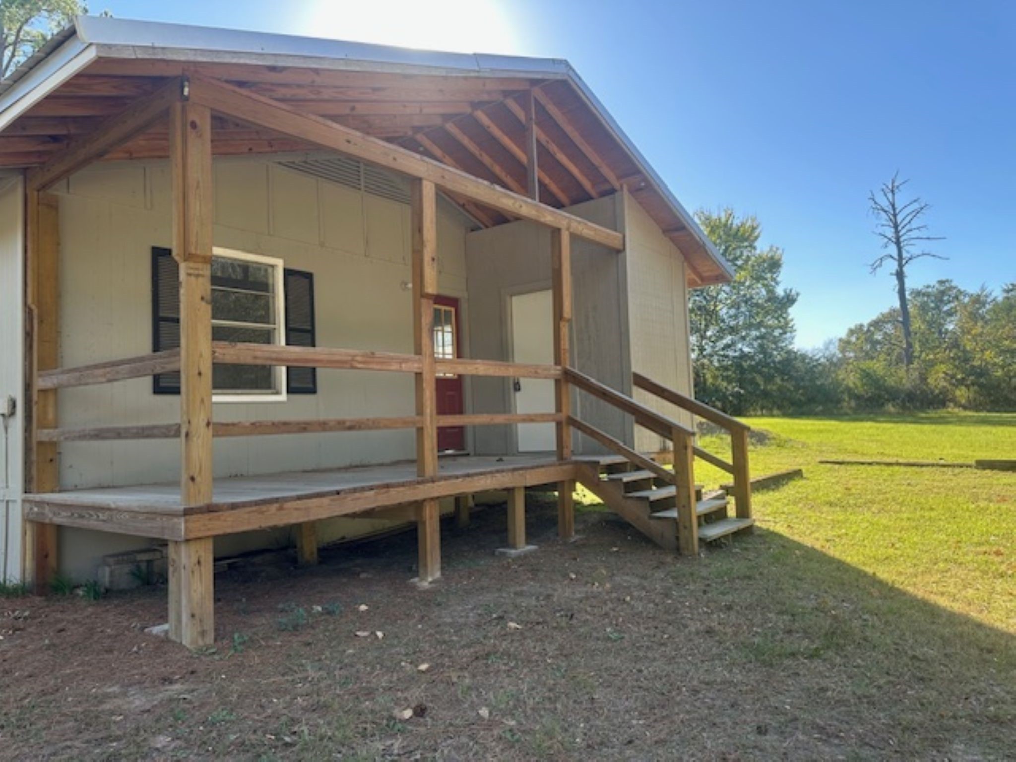 593 County Road 4050 Lovelady, TX 75851 - Photo 2 of 9 a view of a house with a yard and sitting area