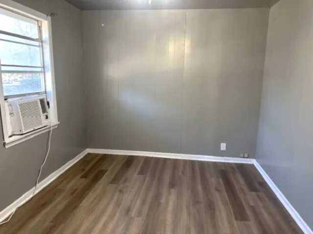 a view of wooden floor and chandelier in a room