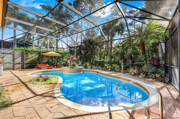 a view of a swimming pool with a patio