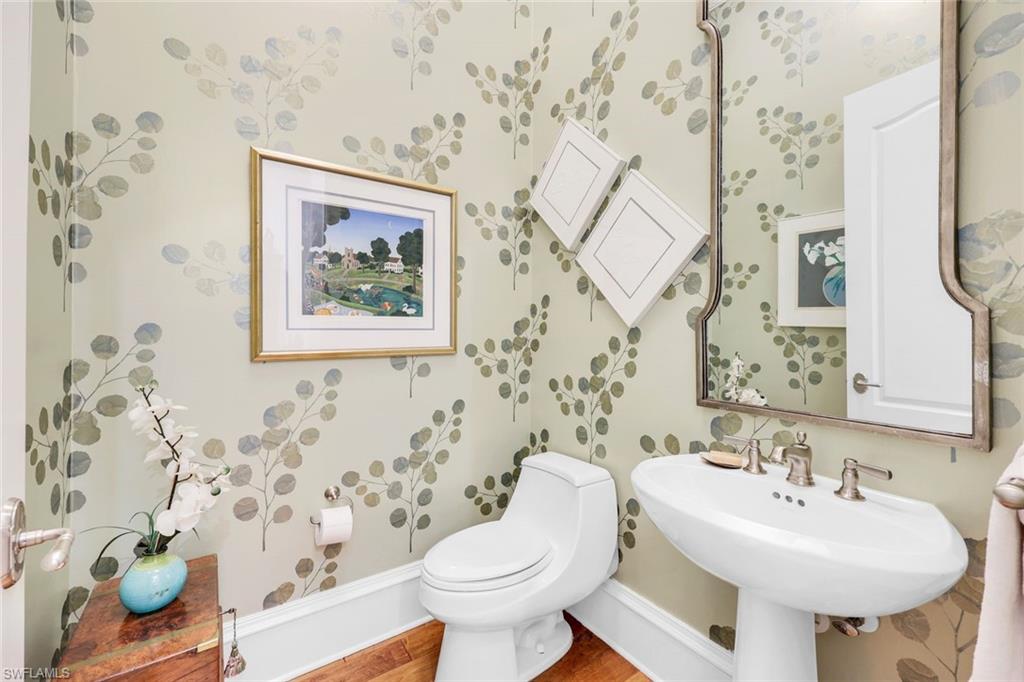 18051 Lagos Way Naples, FL 34110 - Photo 23 of 35 a bathroom with a sink and a toilet