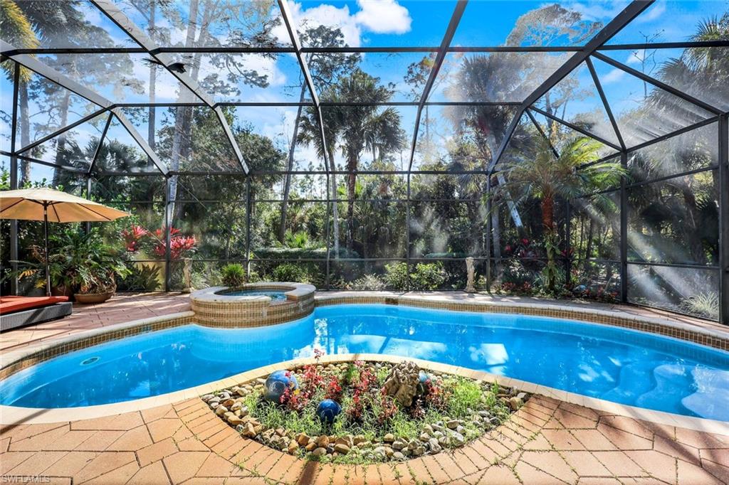 18051 Lagos Way Naples, FL 34110 - Photo 26 of 35 a view of swimming pool with a patio