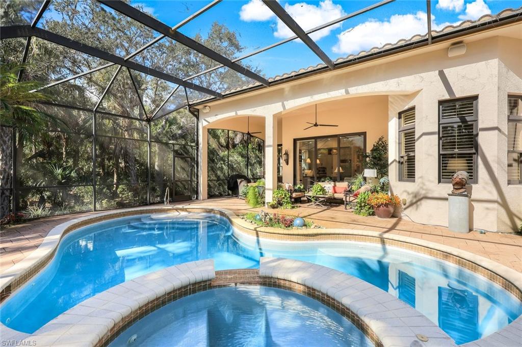 18051 Lagos Way Naples, FL 34110 - Photo 28 of 35 a view of swimming pool with outdoor seating