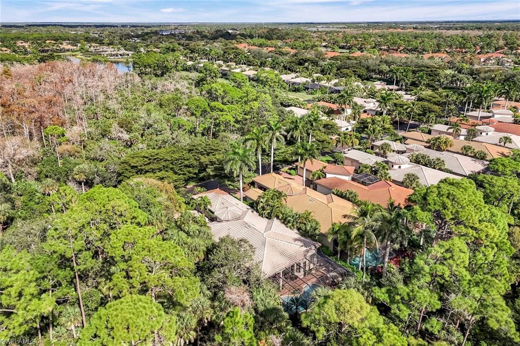 18051 Lagos Way Naples, FL 34110 - Photo 31 of 35 a view of a garden with a building