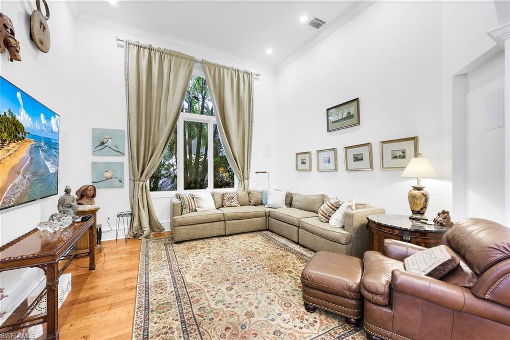 18051 Lagos Way Naples, FL 34110 - Photo 5 of 35 a living room with furniture and a large window