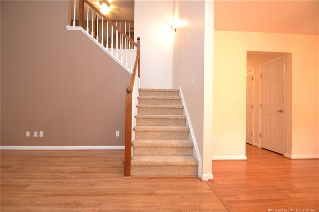 6061 Epping Forest Drive Raleigh, NC 27613 - Photo 2 of 37 a view of entryway with wooden floor