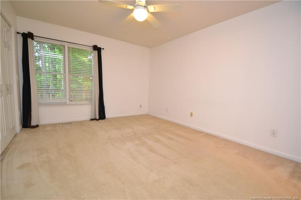 6061 Epping Forest Drive Raleigh, NC 27613 - Photo 22 of 37 an empty room with a window
