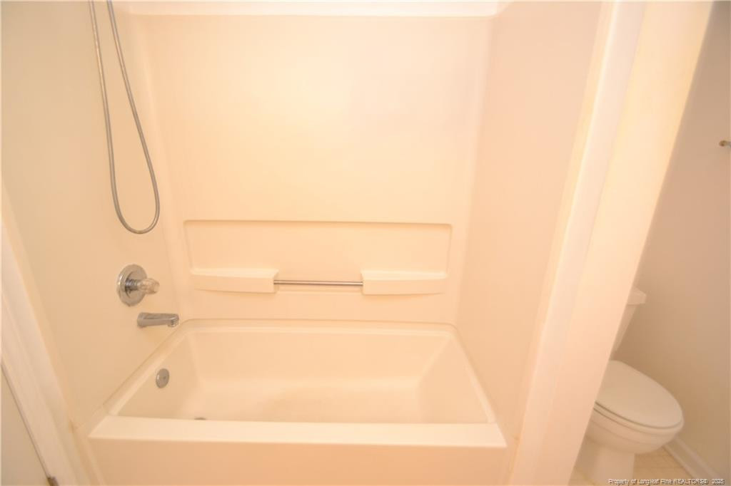 6061 Epping Forest Drive Raleigh, NC 27613 - Photo 27 of 37 a bathroom with a bathtub