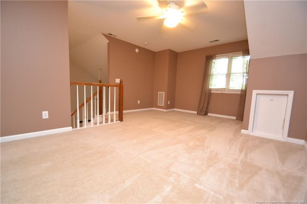 6061 Epping Forest Drive Raleigh, NC 27613 - Photo 32 of 37 a view of an empty room with a window