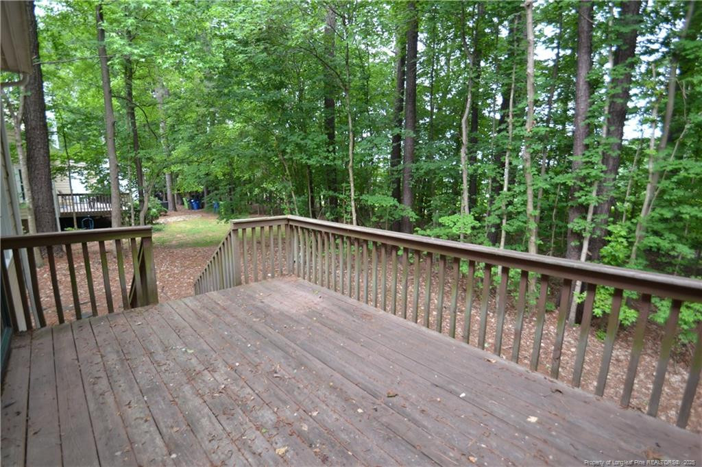 6061 Epping Forest Drive Raleigh, NC 27613 - Photo 36 of 37 a view of balcony with deck and yard