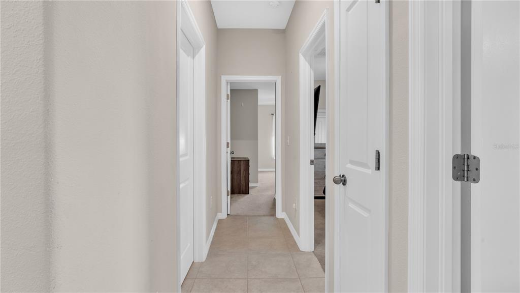 1841 Crinkle Leaf Court Ruskin, FL 33570 - Photo 25 of 35 a view of a bathroom from a hallway